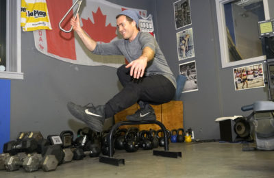CrossFit Banff, Will demonstrates a pistol pose on one leg with the Subway Handle
