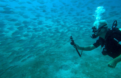 Photo of a Matahari Diver holding the Subway Handle in the Perhentian Islands, Malaysia. We went diving Police Wreck and Batu Caping.