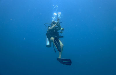 Photo of a Matahari Diver holding the Subway Handle in the Perhentian Islands, Malaysia. We went diving Police Wreck and Batu Caping.